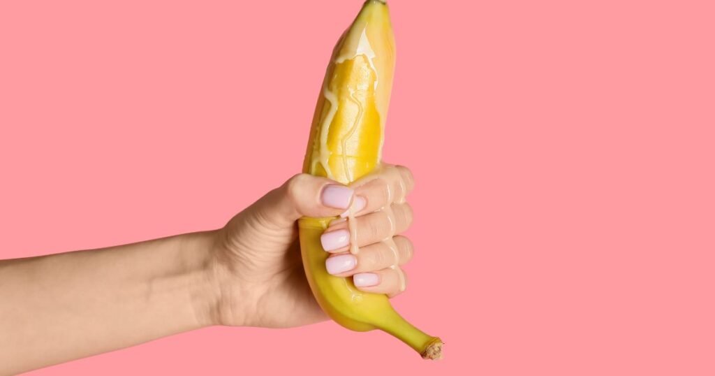 Picture of a woman holding a banana, illustrating Jerk-Off Instructions.